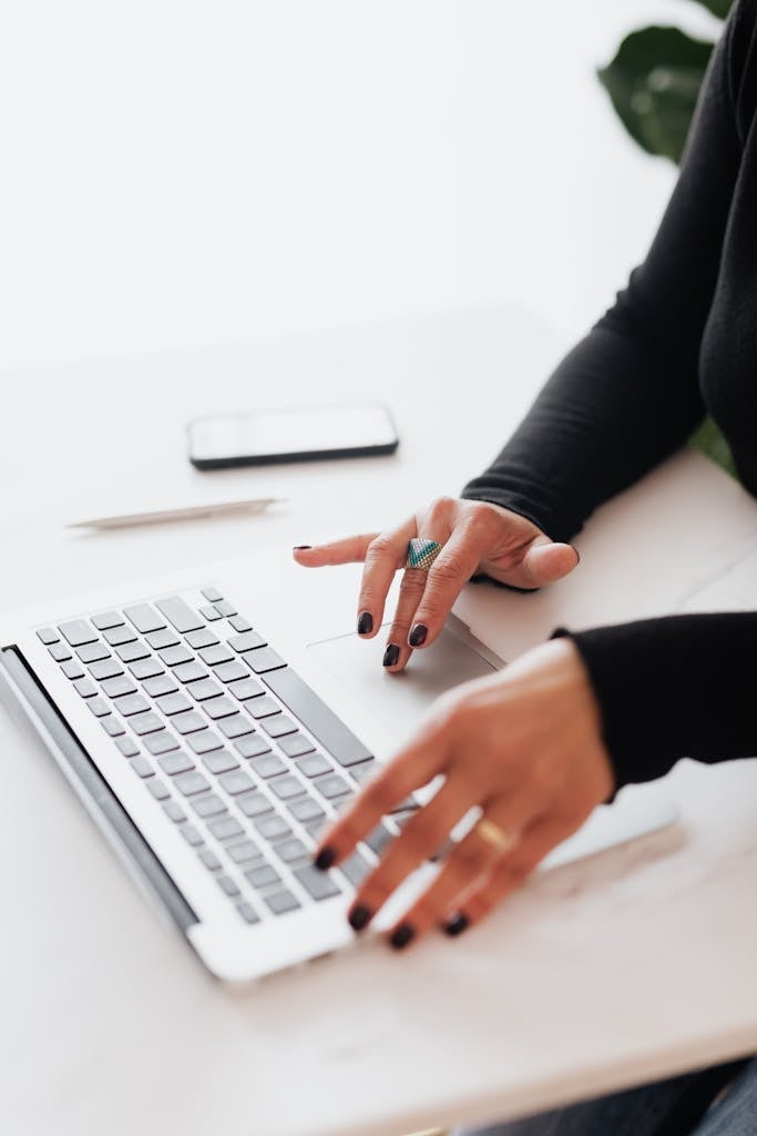 A businesswoman's hands typing on a laptop creating a Kadence WordPress Web Design for Bloggers, Small Businesses & Creators